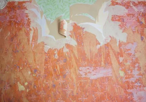 Interior renovation process revealing old wallpaper layers and unfinished pla Stock Photos