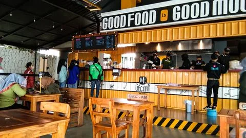 The interior of a restaurant called Mie Gacoan Stock Photos