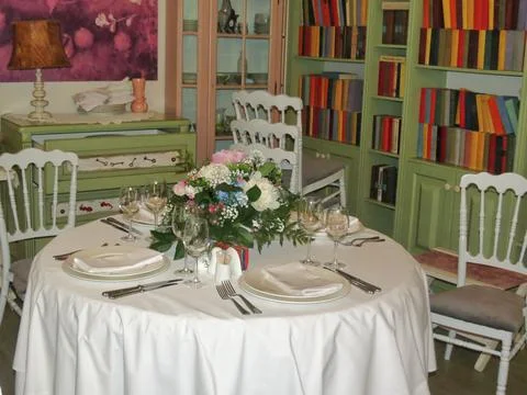 The interior of the restaurant is an elegantly decorated table with a beautif Stock Photos