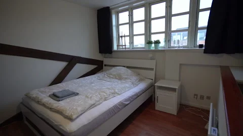 Interior. A room with a bed. Overall plan. Stock Footage 202309564