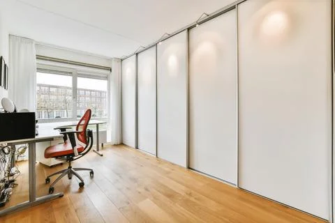 Interior of room with closet and table Stock Photos
