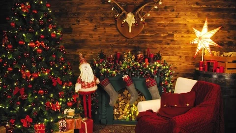 Interior room with elegant Christmas tree, fireplace and a blanket on the couch Stock Footage 98371669
