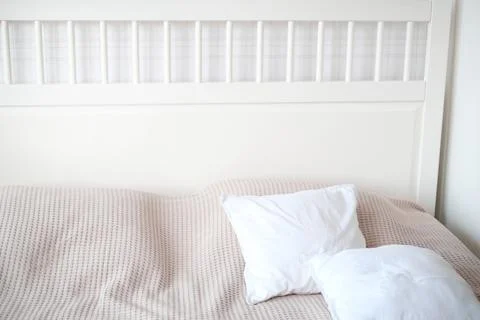 The interior of the room in white tones with a bed and a decorative white Stock Photos