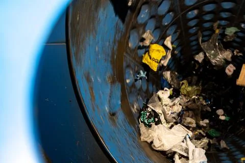 Interior of rotating screening drum separating plastic waste at recycling pla 库存照片