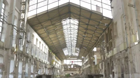Interior of ruined old large building with fallen bricks on the floor, tilt down Stock Footage 57376310