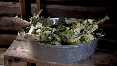 Interior of a Russian steam bath. Close-up of oak brooms in the bathhouse. 4K Stock Footage 131102254