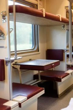 Interior of a Russian train with comfortable bench and seating with nobody in Stock Photos
