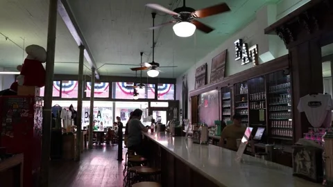 Interior of a rustic cafe with counter and ceiling fans Stock Footage 336350200