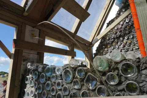 Interior of a self-made home with cans and wood. Stock Photos