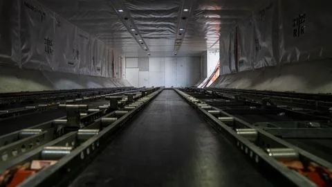 Interior shot of an empty cargo compartment on a 787 commercial airplane. Stock Photos