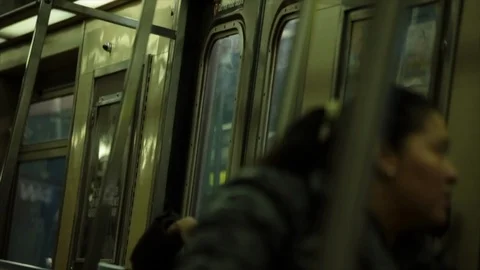 Interior shot from inside a New York subway train cart as train stops and doors Stock-Footage 107622821