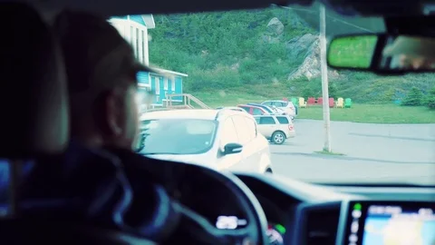 Interior shot of a man driving through a east coast town Stock Footage