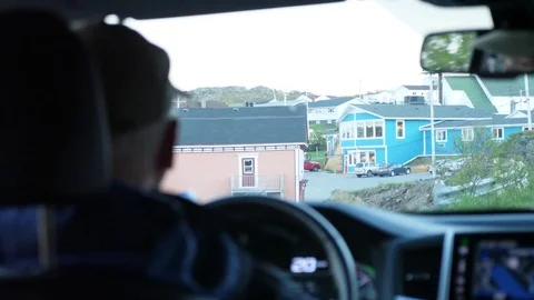 Interior shot of a man driving through east coast town Stock Footage 77767170