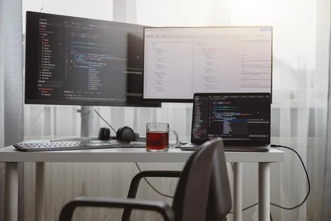 Interior shot. Workplace of a programmer, IT job, home, Computer monitors and Stock Photos