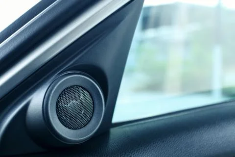 Interior side door speaker in modern car, tweeter audio sound system Stock Photos