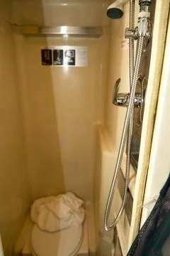 Interior of a small bathrooom with a shower Foto stock