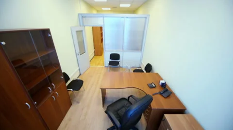 Interior of small empty office room with black armchair Video stock 33295563