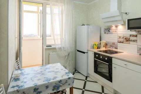 The interior of a small kitchen with a balcony Foto stock