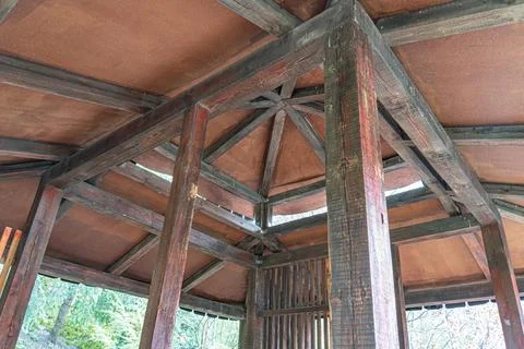 Interior space with aged wooden structure showcasing geometric patterns, ba.. 스톡 사진