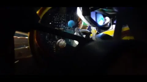 The interior space of an electronic device illuminated by moving light. Stock Footage 323825625