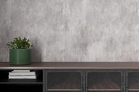 This interior space features a minimalist design with a blank wall, ideal f.. Stock Photos