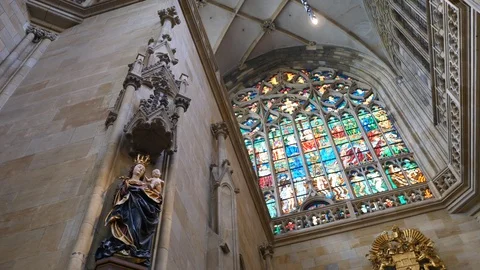 Interior of St. Vitus Cathedral With Stained-Glass Window And Sculptures. Video stock 111134091