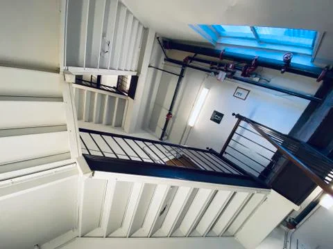 Interior staircase forms abstract pattern, similar to art by M C Escher 스톡 사진