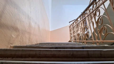 Interior Staircase with Ornate Metal Railing and Plastered Walls Vídeos de archivo 346441326