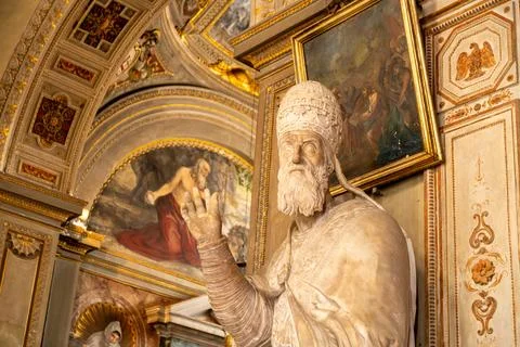 Interior statue of a pope in chapel Photos