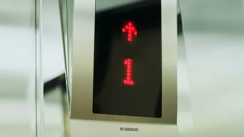 Interior of steel silver elevator which rises up inside of modern business Stock Footage 119915968