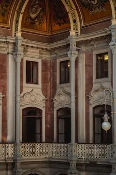 The interior of a structure featuring a balcony and pillars Stock Photos