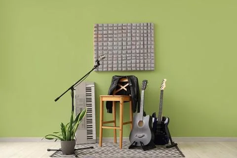 Interior of studio with chair, microphone and guitars Stock Photos