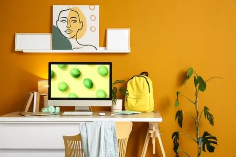 Interior of stylish office with workplace, shelf and plant Stock Photos