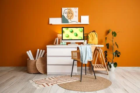 Interior of stylish office with workplace, shelf and plant Stock Photos