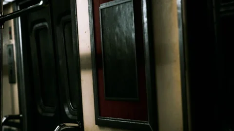 Interior of a subway train with dark panels and contrasting colors Stock Footage 342040199