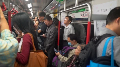 Interior of subway train with locals and tourist traveling 動画素材 90497224