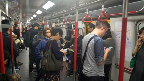 Interior of subway train with locals and tourist traveling Stock Footage 90497225