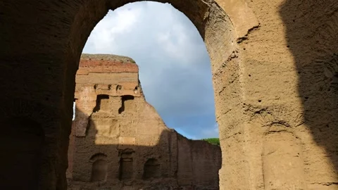 Interior through massive ruined brick archway baths caracalla immense Stock Footage 324760427