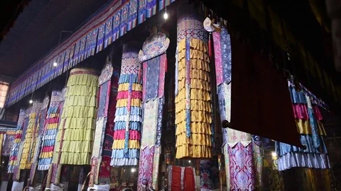 Interior of a Tibetan Monastery prayer room with monks clothing Stock Footage 72510675