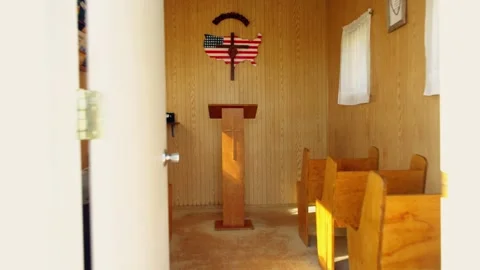 Interior of the tiny U.S. Center Chapel with pews and pulpit Vídeos de archivo 345531073