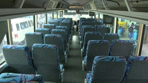Interior of tour bus with empty seats and shelves Stock Footage 116421048