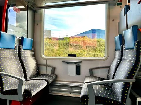 Interior of a train cabin with four seats Stock Photos
