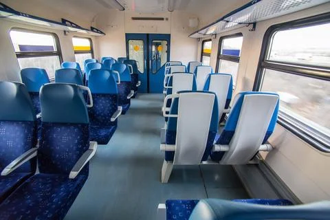 Interior of the train car with empty seats Stock Photos