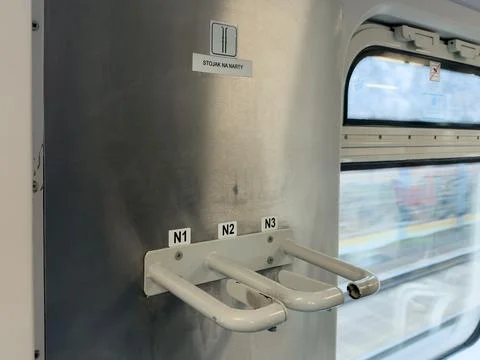 Interior train compartment features specialized rack for holding skis, enha.. Stock Photos
