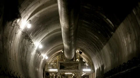 Interior Tunnel Construction Tilt Down from Vent Stock Footage 89980674