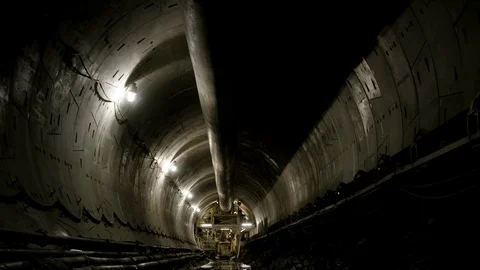 Interior Tunnel - Men exiting vehicle - Wide Zoom Out Stock Footage 89980691