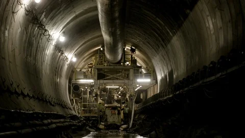 Interior Tunnel - Men exiting vehicle - Zoom Out Stock Footage 89980699