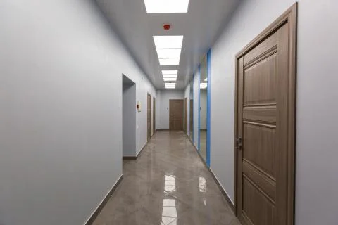 Interior of typical office - empty corridor - without furniture after Stock Photos