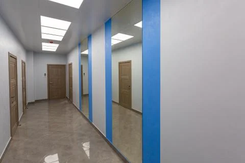 Interior of typical office - empty corridor - without furniture after Stock Photos