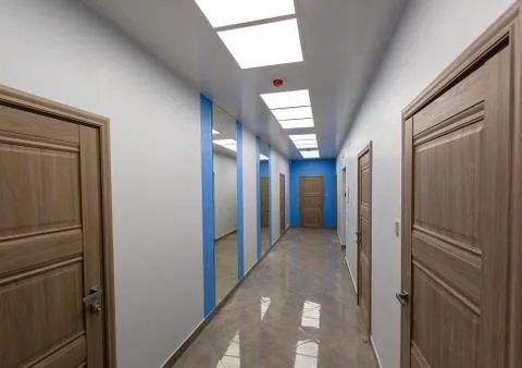 Interior of typical office - empty corridor - without furniture after Stock Photos